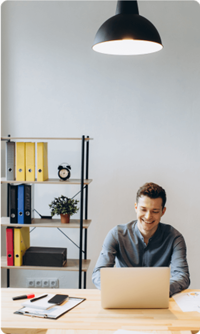 Man working at desk with laptop